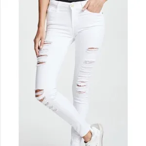 Frame Le Skinny De Jeanne ripped white jeans