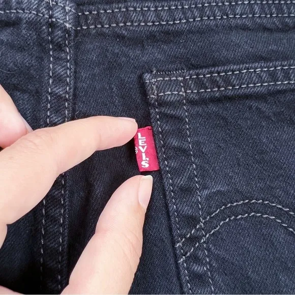 Levi’s • Wedgie Icon jean Black Desert distressed raw hem ripped knee slim