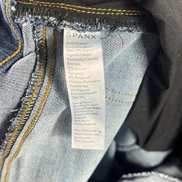 SPANX Distressed Ankle Skinny Jeans in Medium Wash.