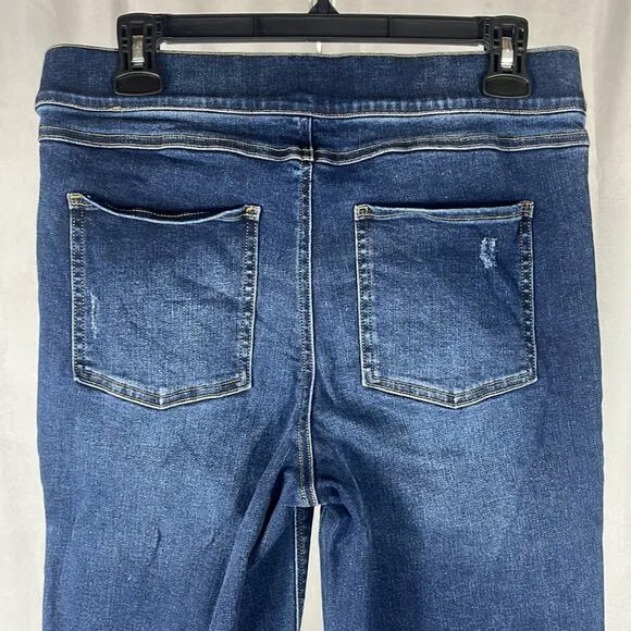 SPANX Distressed Ankle Skinny Jeans in Medium Wash.