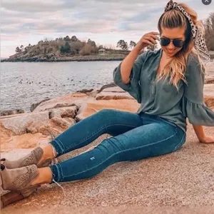 SPANX Distressed Ankle Skinny Jeans in Medium Wash.