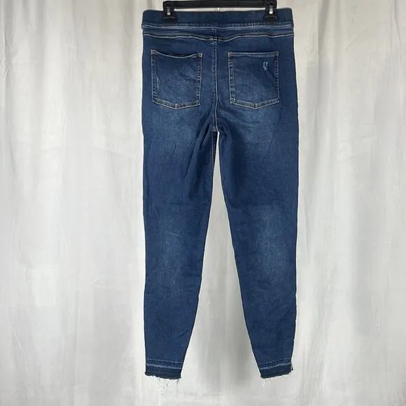 SPANX Distressed Ankle Skinny Jeans in Medium Wash.