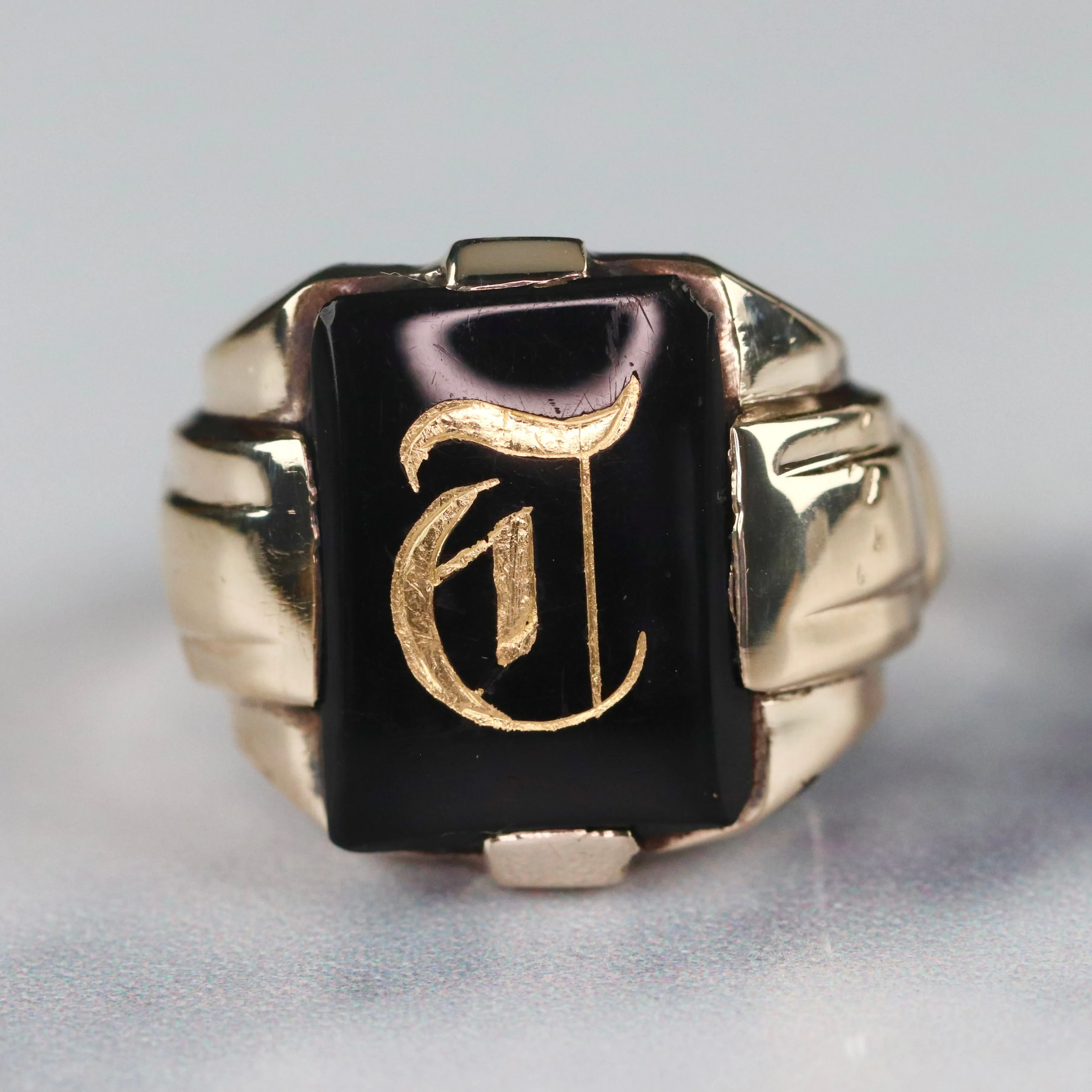 Vintage onyx letter T ring in yellow gold